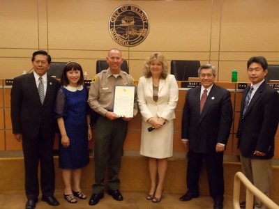 Walnut Council presents Captain Jeff Scroggin with an appreciation proclamation; (L-R) council members Tony Cartagena and Mary Su; Captain Scroggin; Mayor Nancy Tragarz; council member Bob Pacheco; and Mayor Pro Team Eric Ching. (Photo Courtesy:  Raymond Mendoza)