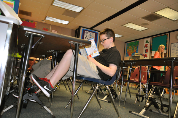 South Pointe Middle School special education students have begun reading and riding using stationary pedals to improve reading skills. (Photo Courtesy:  Kelli Gile)