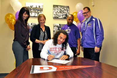 (Photo Courtesy:  Kelli Gile) DBHS football player, Isaiah Thompson, signed a national letter of intent to play at Dixie State University on March 9. Shown with Principal Catherine Real; Grade Level Coordinator, Sonja Burns; Coach Marcus Hughes; and Athletic Director Kevin Ferguson.