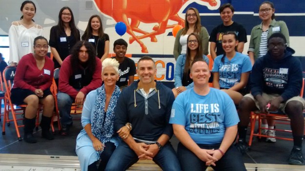 (Photo By:  Clara Steele) The C.H.E.E.R. Leaders pose with Kurt and Brenda Warner, and teacher Jordan Samson