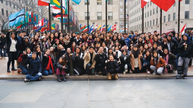 (Photo Courtesy:  Kelli Gile) The 140-member Diamond Bar High School Symphony Orchestra celebrates their 1st place Orchestra Cup award while sightseeing at New York City’s Rockefeller Center.