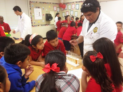 (Photo Courtesy: Juliette Funes) La Verne Science and Technology students learn to conduct science experiments from students from Palomares Academy of Health Sciences in the school’s new science lab.