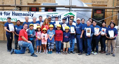 Photo Courtesy:  WVUSD Together we can make a difference! C.J. Morris Elementary third graders delivered lunches to Habitat for Humanity volunteers on May 23. Shown with teacher Lisa Peterson.