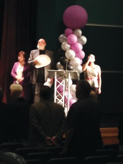 Photo Courtesy: Eastvale News Sharyn Link and Mayor Ike Bootsma enjoy the National Anthem by ERHS student, Briana Velasquez.