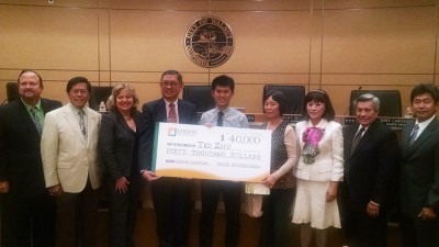Photo By: Raymond Mendoza Walnut City Council members, along with Walnut High Principal Jeff Jordan and So Cal Edison Representative Ben Wong, present Ted Zhu with a $40,000 scholarship from Edison’s program. Zhu's mother is also in the photo, next to her son.