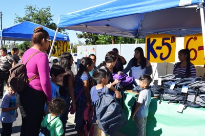 Photo Courtesy:  PUSD Pomona Unified children line up to receive age-appropriate school materials, during the District’s Family Support and Resource Center's annual Backpack and School Supply Giveaway event on Aug. 5.