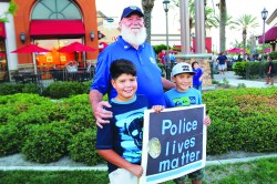 Photo courtesy: WOLFF  Mayor Ike Bootsma supporting Law Enforcement with two young Eastvale residents.