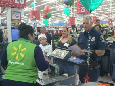 Photo courtesy: CVUSD A Walmart employee checks out a student and his chaperones.