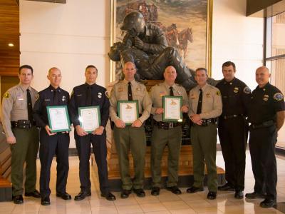 Deputies honored for their life-saving actions pictured with Sheriff McMahon.
