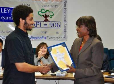 Photo courtesy of WVUSD Board President Helen Hall awards Ron Hockwalt Academies senior TJ Davis the school’s Super Star Student Award on January 20. 