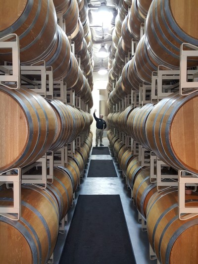 Photo by Jerry Silva Dominic Menton, Operations Manager, between rows of wine barrels at the San Antonio Winery in L.A.  
