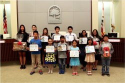 Photo courtesy: City of Chino Hills Top row (L-R): Myra Zhan, 12th Grade, Ayala High School; Sophia Yujin Yang, 11th Grade, Diamond Bar High School; Ashley Robles, 8th Grade, Canyon Hills Junior High; Joshua Chou, 7th Grade, Chaparral Middle School; Jason Goo, 6th Grade, Hidden Trails Elementary; Audrey Han, 5th Grade, Wickman Elementary; Priyasha Panigrahi, 6th Grade, Country Springs Elementary;  Bottom row (L-R): Derek Yang, 4th Grade, Wickman Elementary; Zoe Villegas-Kellerman, 3rd Grade, Litel Elementary; Jay Bhullar, 2nd Grade, Rolling Ridge Elementary; Annie Kung, 1st Grade, Eagle Canyon Elementary; Emma Shiozaki, Kindergarten, Wickman Elementary School; Ethan Hsiao, 3rd Grade, Rolling Ridge Elementary