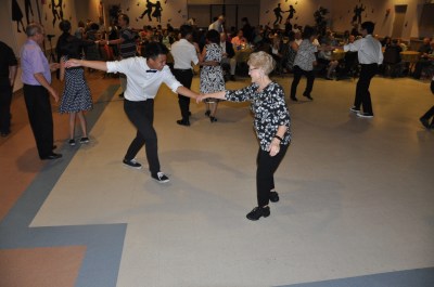 Photo courtesy: Kelli Gile Walnut High students paired up with local seniors for a Lindy Hop dance lesson. Shown: Freshman Brian Duran teaches community member Leann Curren some new steps. 