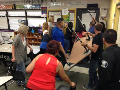 CVUSD staff members participate in the ALICE Training to prevent an “intruder” from entering the room.