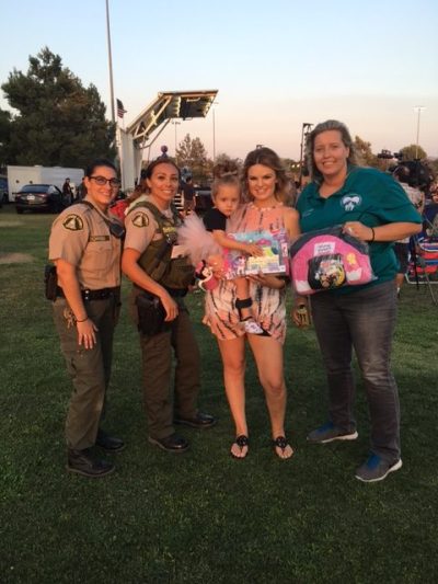 Photo courtesy: JCSD Local law enforcement and officials gave gifts to Finley and her mother Christina.