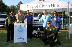 Photo courtesy: City of Chino Hills ): Sergeant Venegas, Deputy Arden, Juan Isas, Mayor Art Bennett, Deputy Franco, and Sonia Martin Del Campo