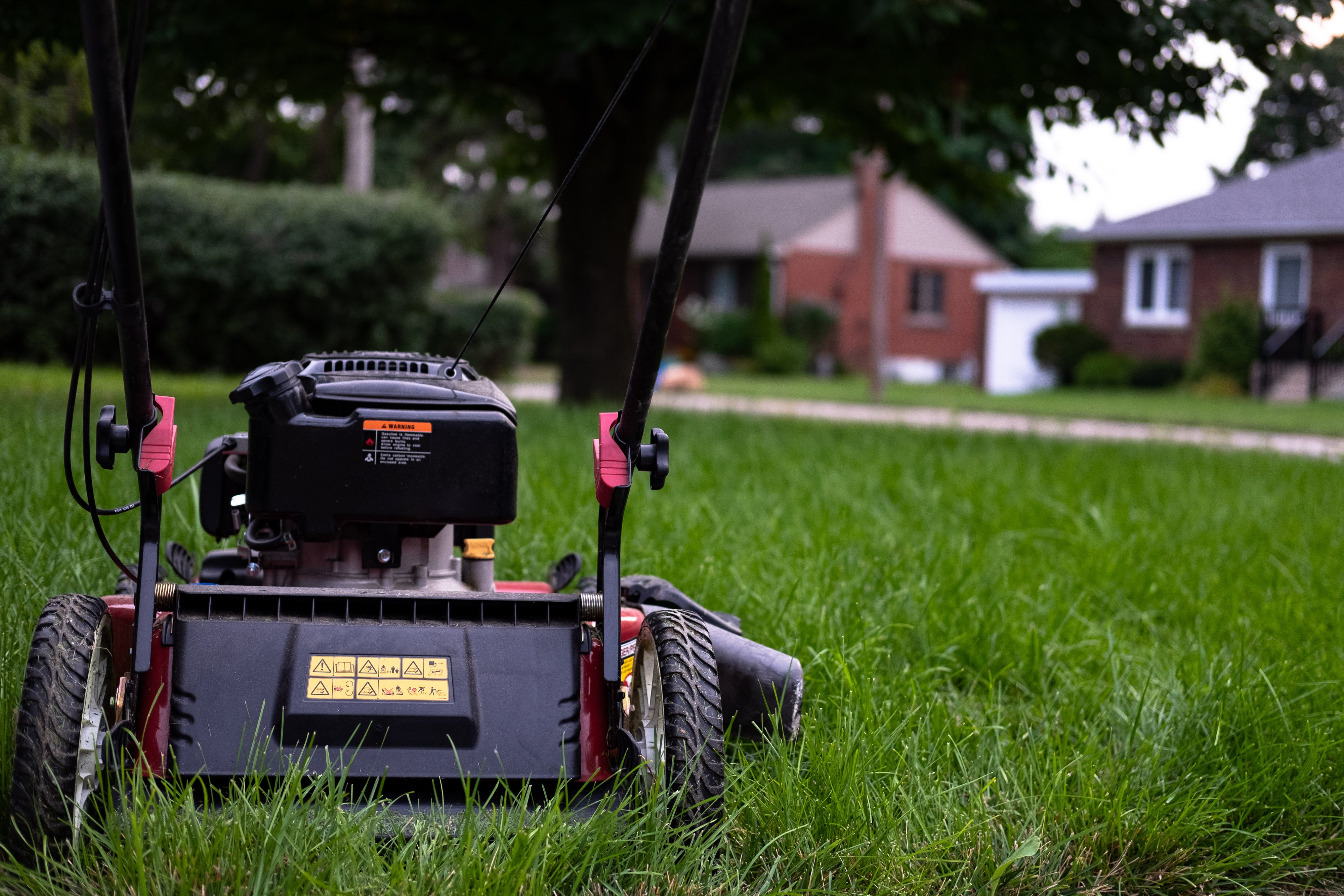 Cvr.Eastvale.lawn-mower-sitting-on-grass_4460x4460